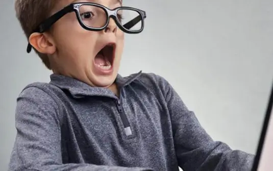Child shocked at laptop for website copywriting services