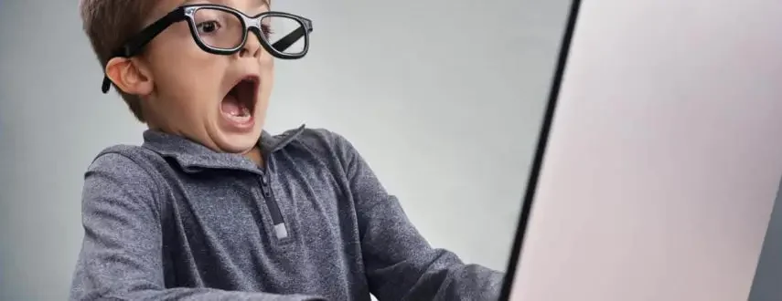 Child shocked at laptop for website copywriting services