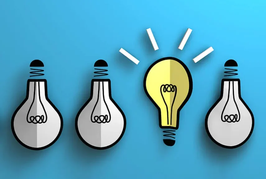 Four upside down lightbulbs, one lit facing up graphic design